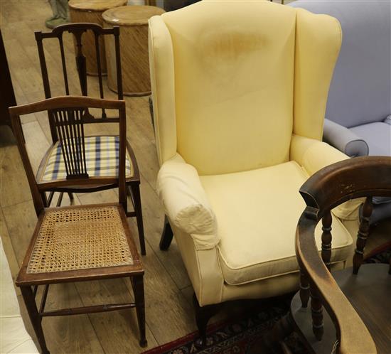 A 1920s wing armchair and two salon chairs